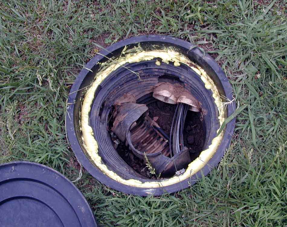 manhole for coaxial cables and control cables